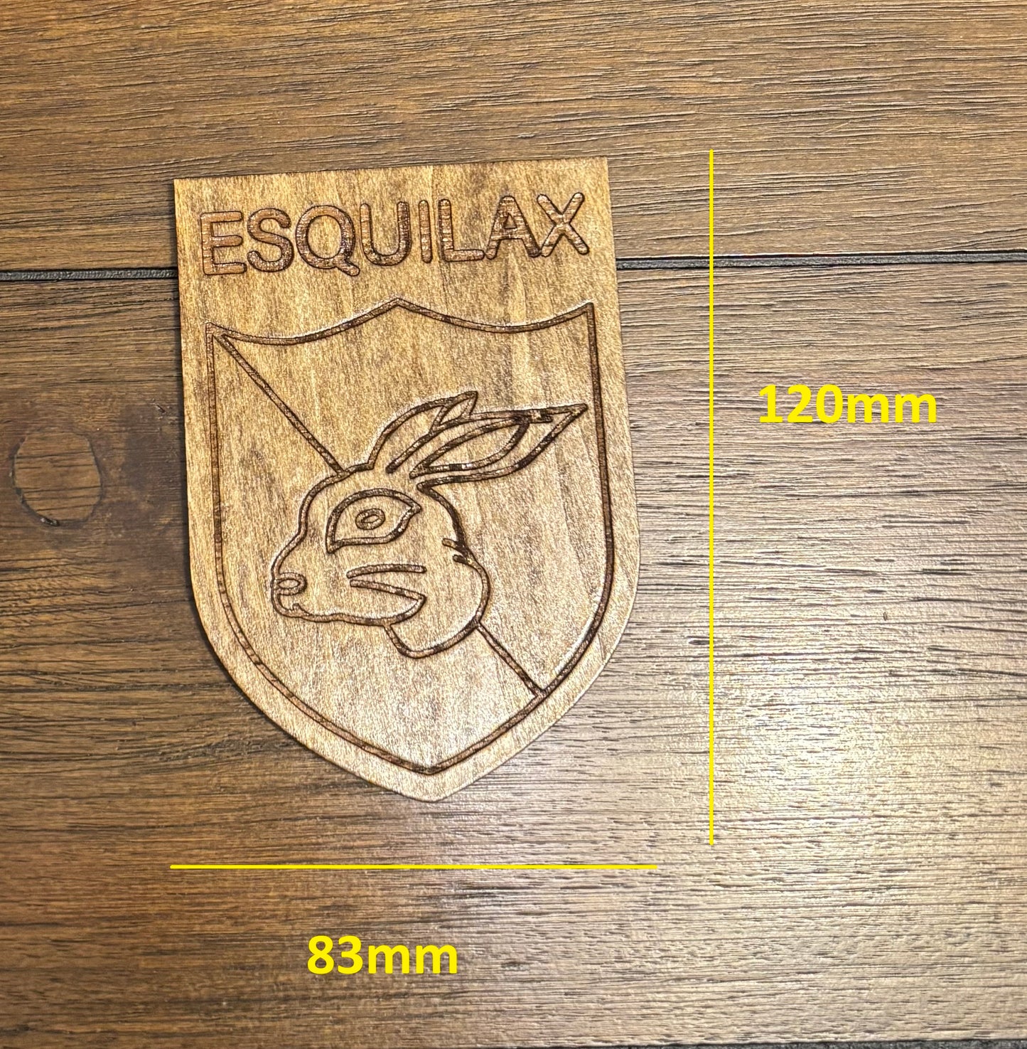Stained basswood fridge magnet of the Esquilax banner from the Simpsons