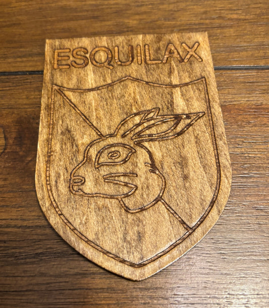 Stained basswood fridge magnet of the Esquilax banner from the Simpsons