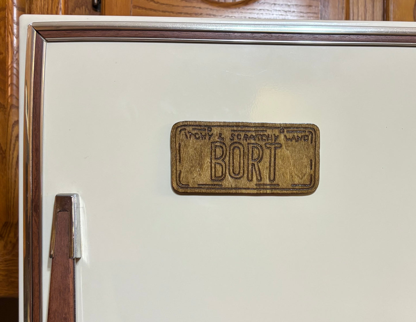 Stained basswood fridge magnet of the Bort licence plate from the Simpsons