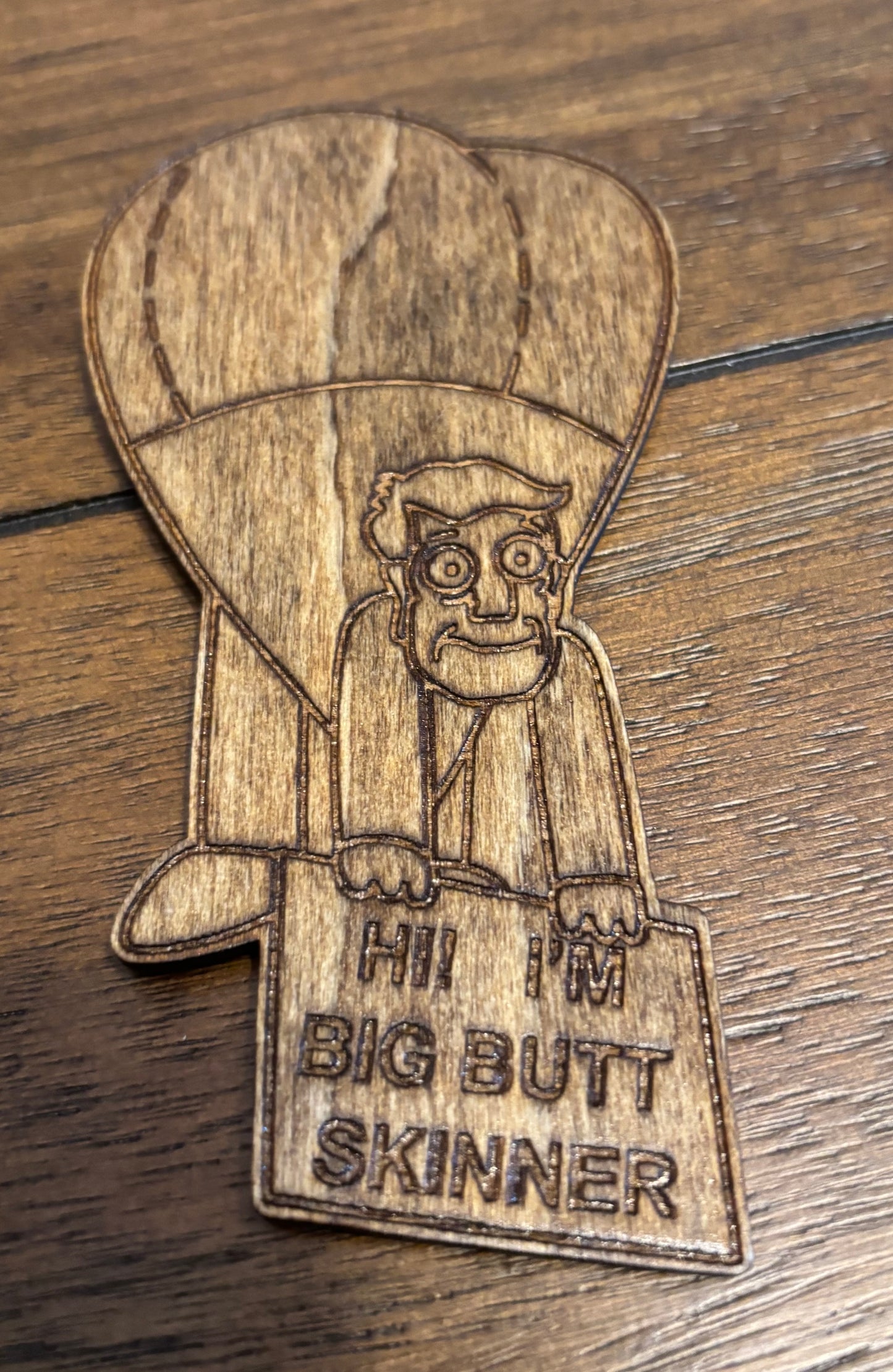 Stained basswood fridge magnet of Buttzilla from the Simpsons