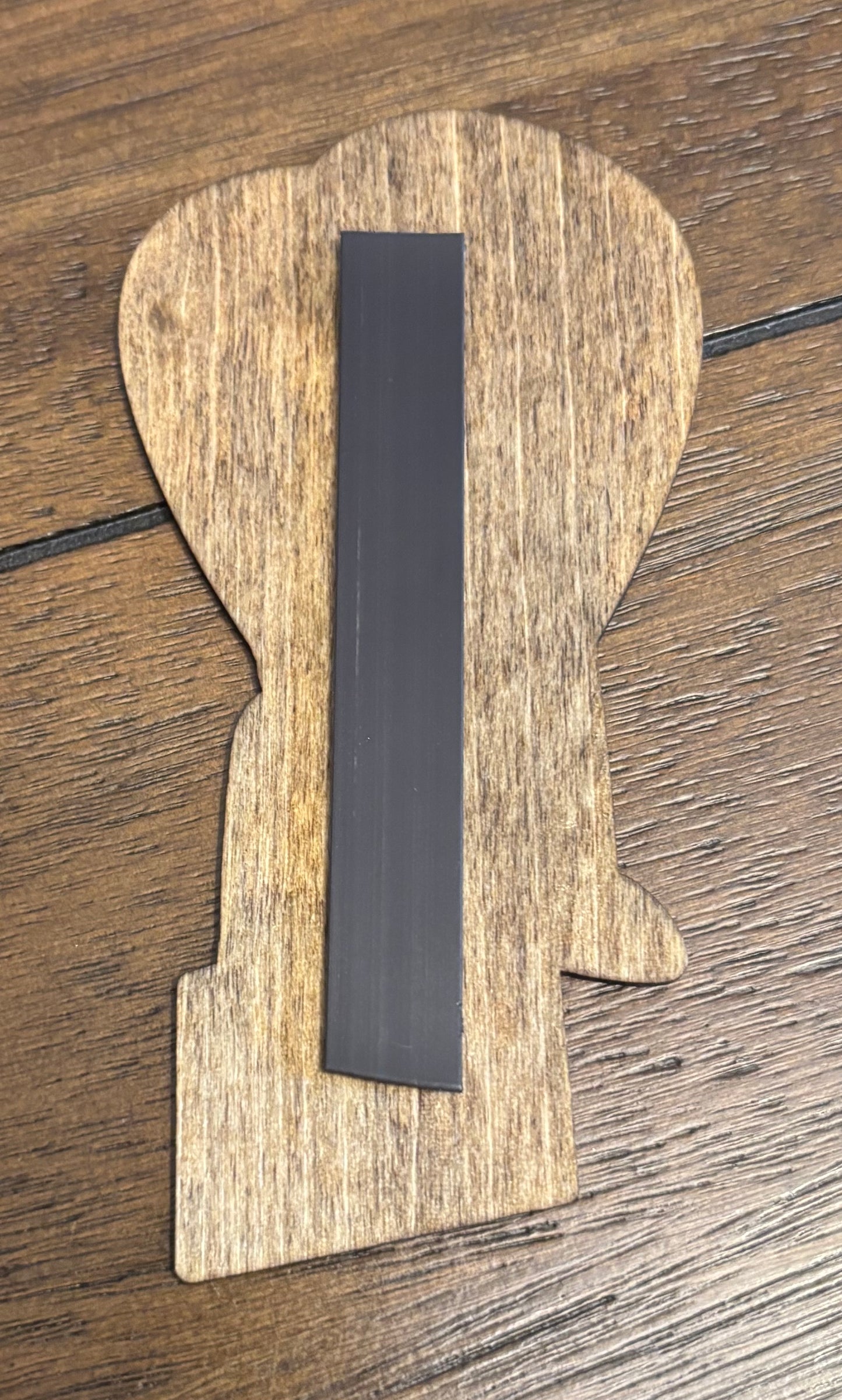 Stained basswood fridge magnet of Buttzilla from the Simpsons