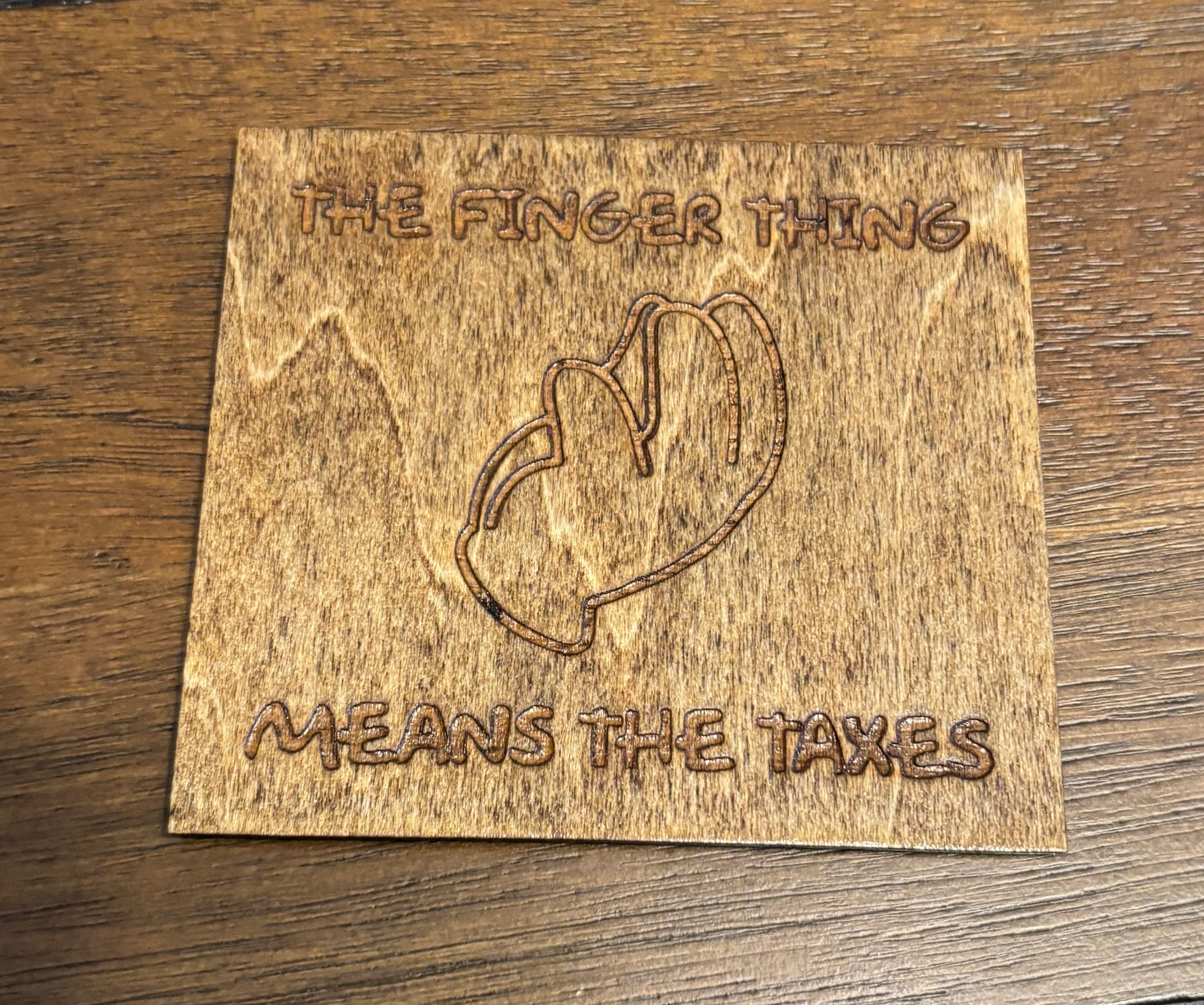 Stained basswood fridge magnet of the Finger thing means the taxes from the Simpsons