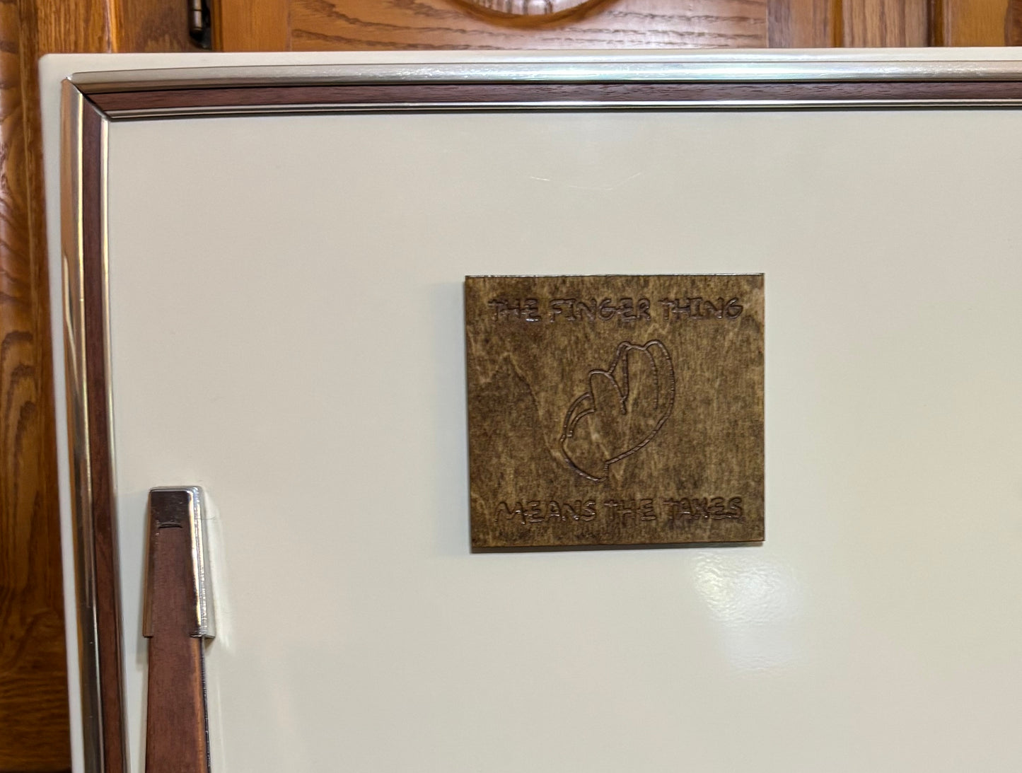 Stained basswood fridge magnet of the Finger thing means the taxes from the Simpsons
