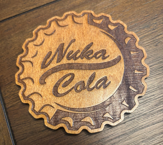Stained basswood fridge magnet of the Nuka-Cola logo from the Fallout video games