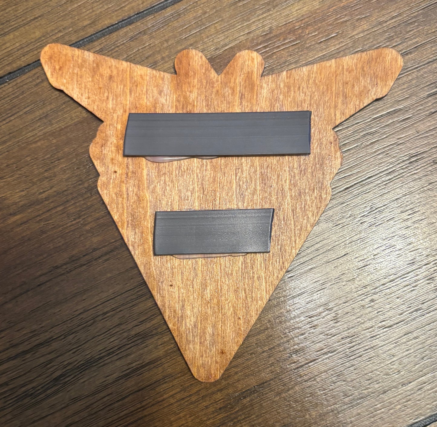 Stained basswood fridge magnet of a the Team Instinct logo from the Pokemon video games