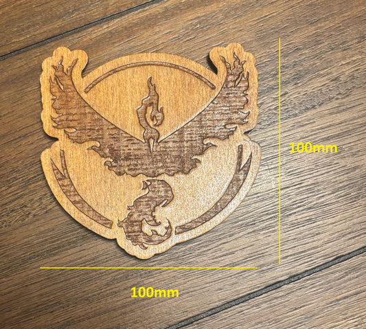 Stained basswood fridge magnet of a the Team Valor logo from the Pokemon video games