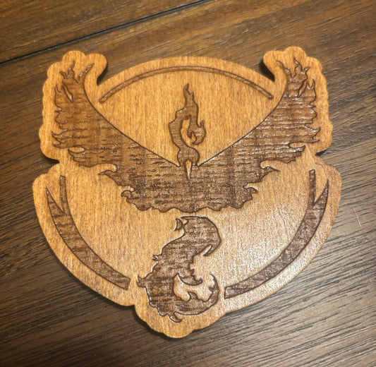Stained basswood fridge magnet of a the Team Valor logo from the Pokemon video games