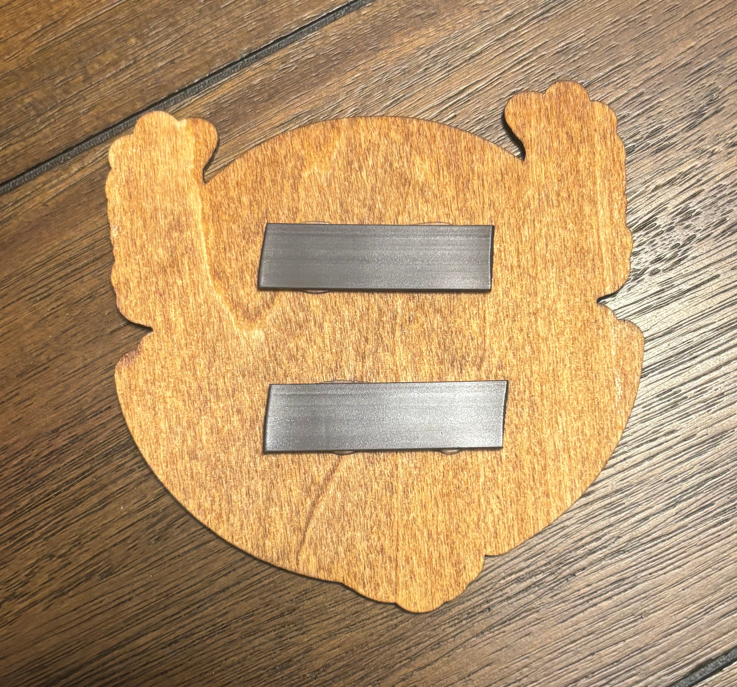 Stained basswood fridge magnet of a the Team Valor logo from the Pokemon video games