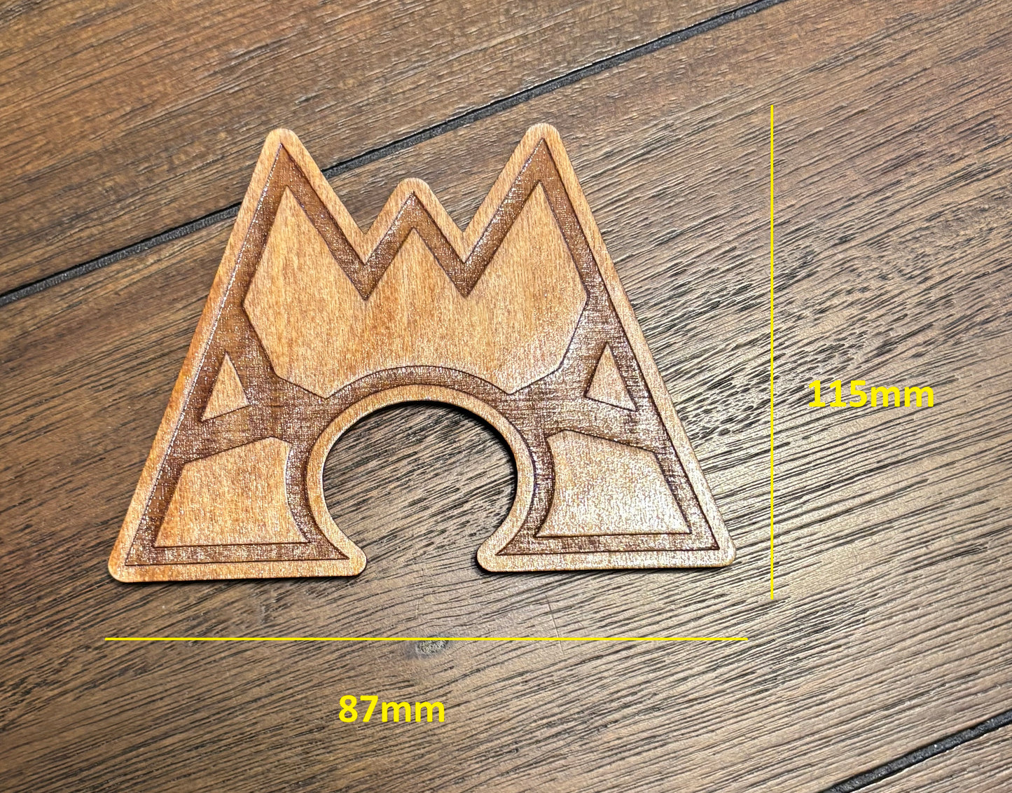 Stained basswood fridge magnet of a the Team Magma logo from the Pokemon video games