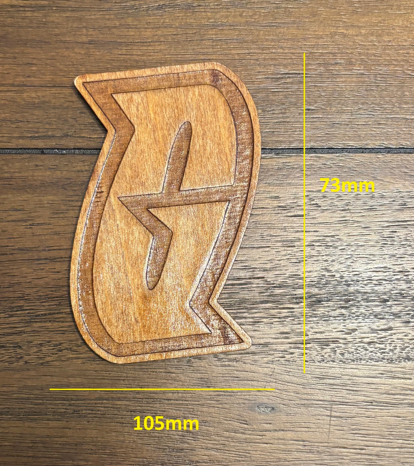Stained basswood fridge magnet of a the Team Galactic logo from the Pokemon video games