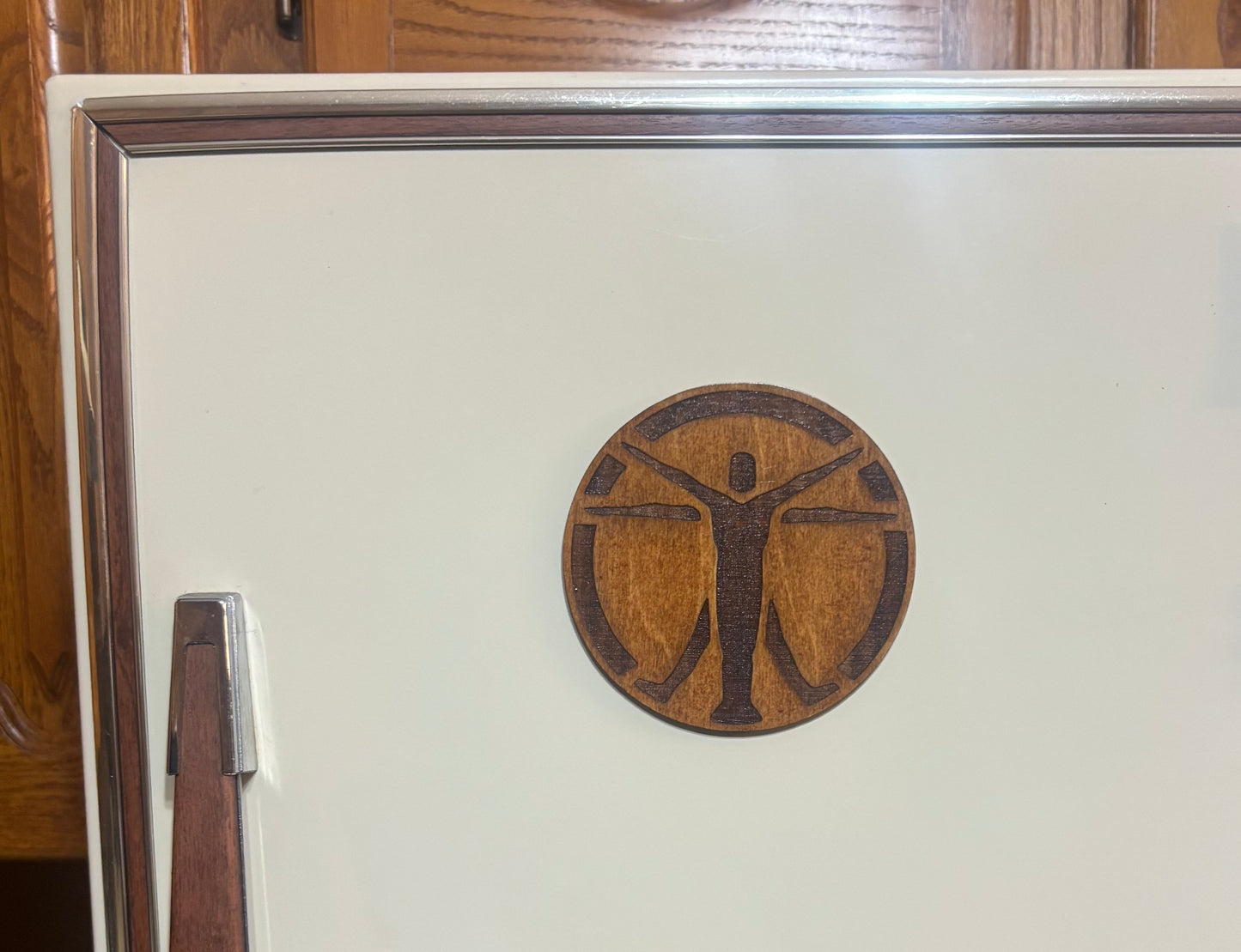 Stained basswood fridge magnet of the Institute logo from the Fallout video games