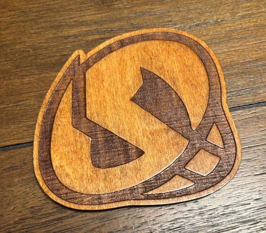 Stained basswood fridge magnet of a the Team Skull logo from the Pokemon video games
