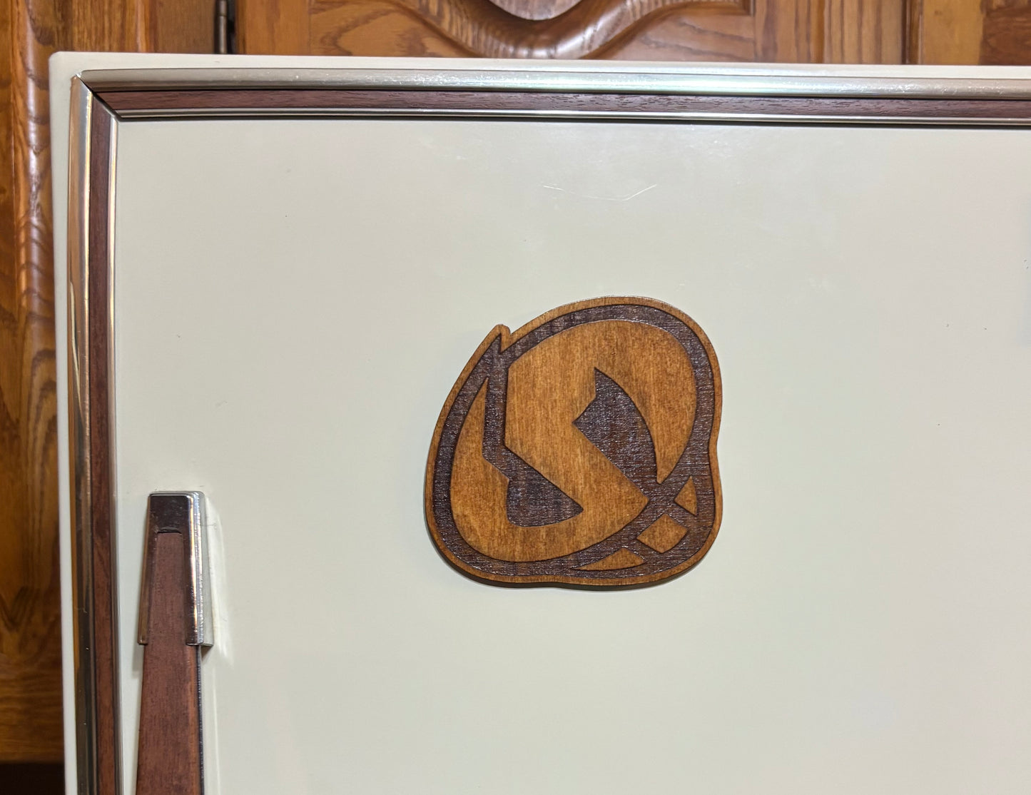 Stained basswood fridge magnet of a the Team Skull logo from the Pokemon video games