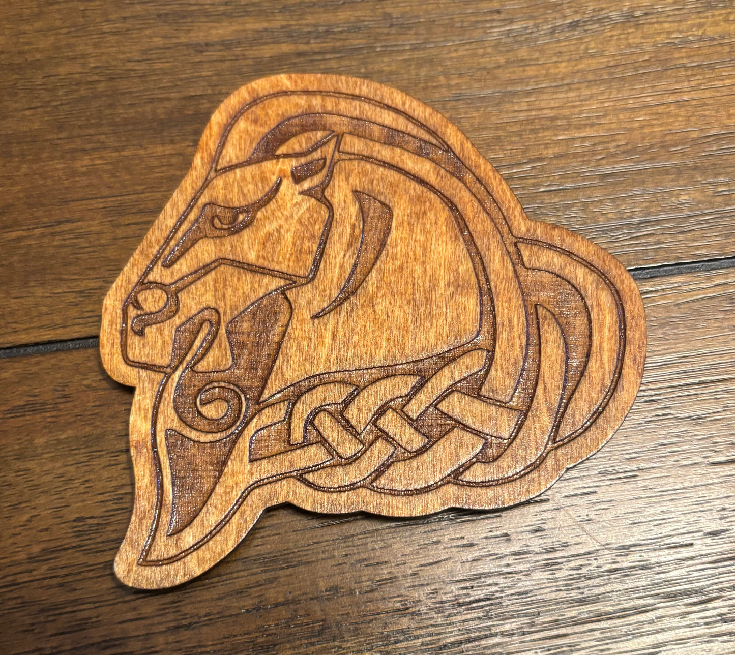 Stained basswood fridge magnet of the Whiterun sigil from the Skyrim video game