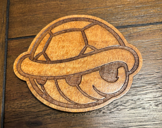Stained basswood fridge magnet of a Turtle shell from the Mario video games