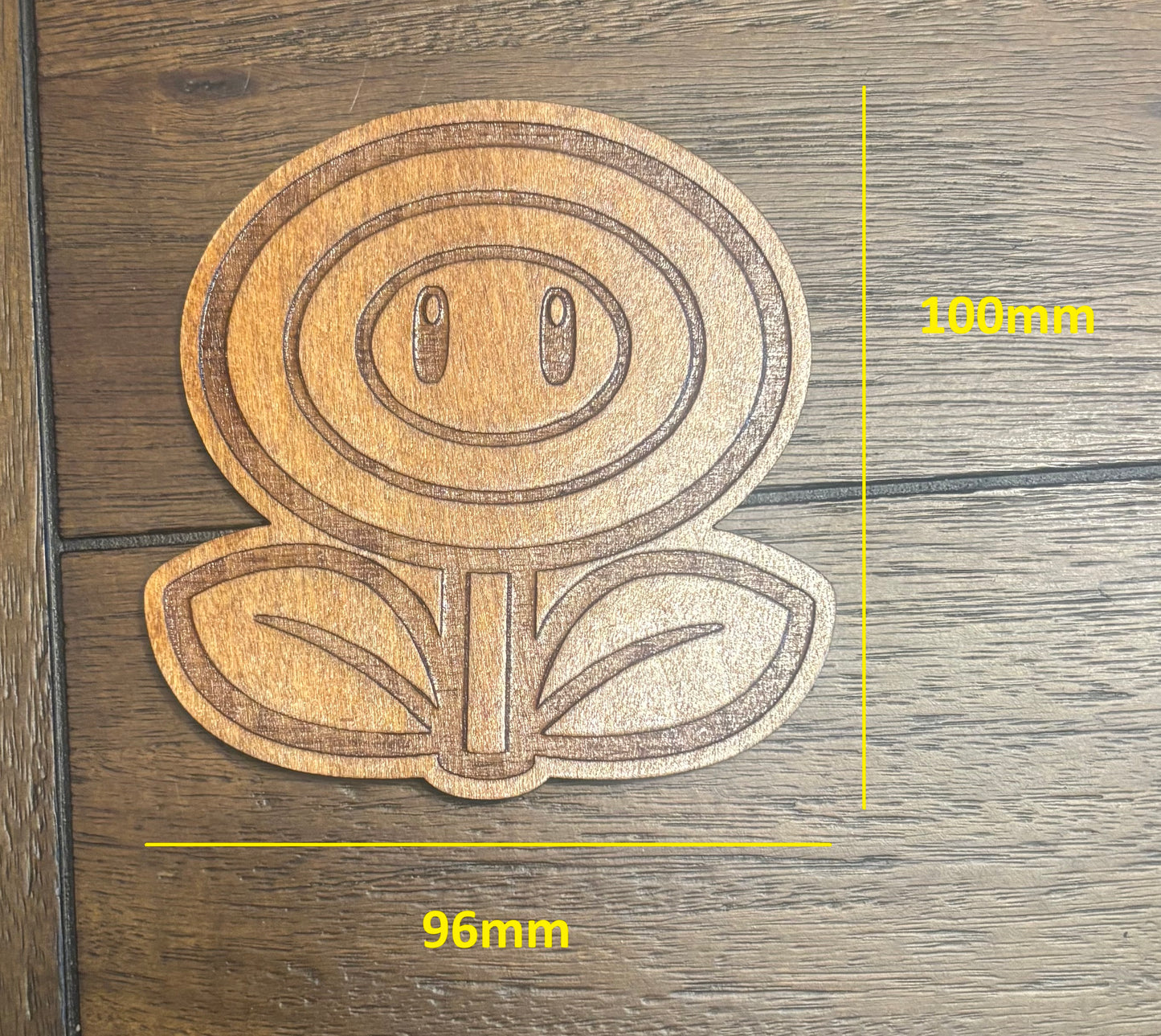 Stained basswood fridge magnet of a Flower power up from the Mario video games