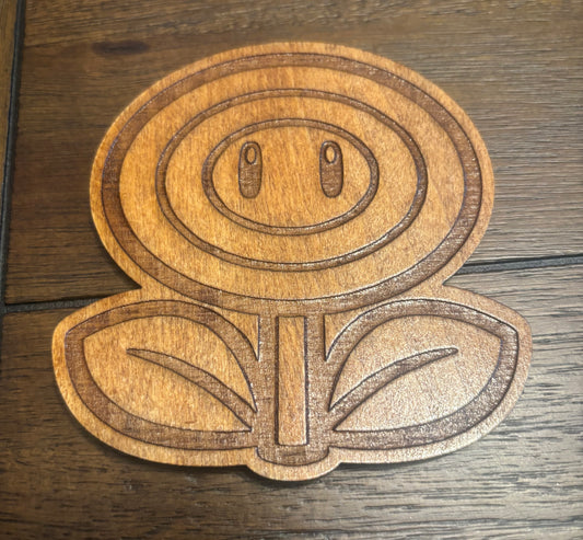 Stained basswood fridge magnet of a Flower power up from the Mario video games