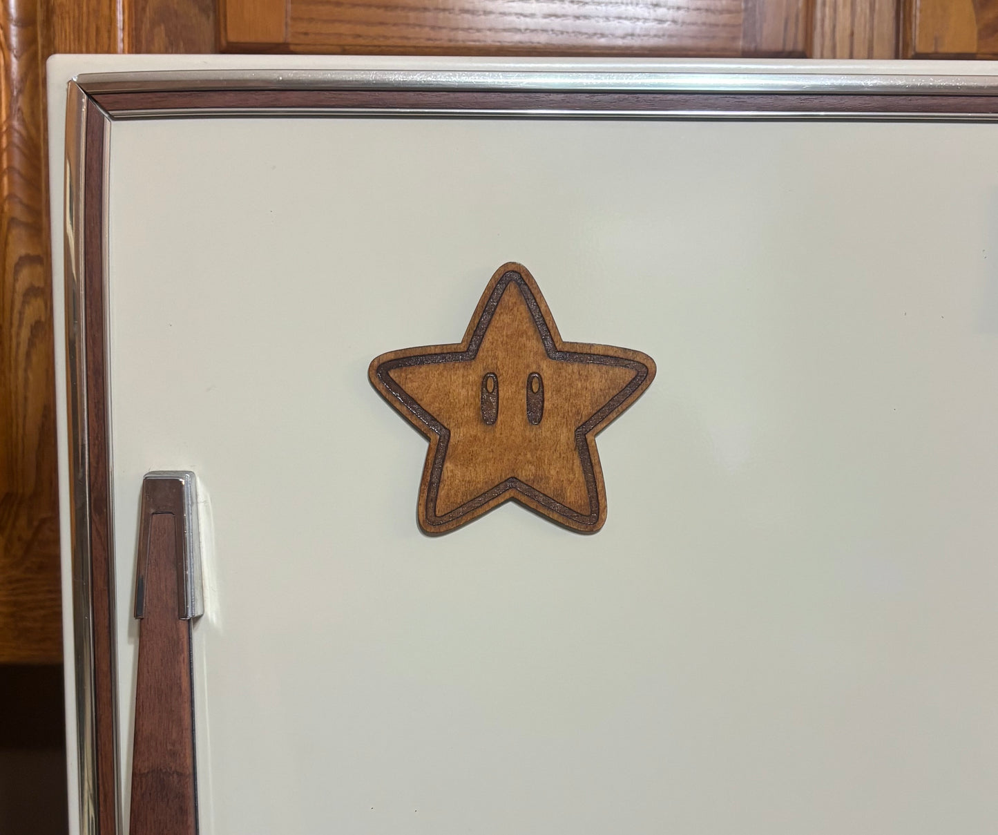 Stained basswood fridge magnet of a Super star from the Mario video games