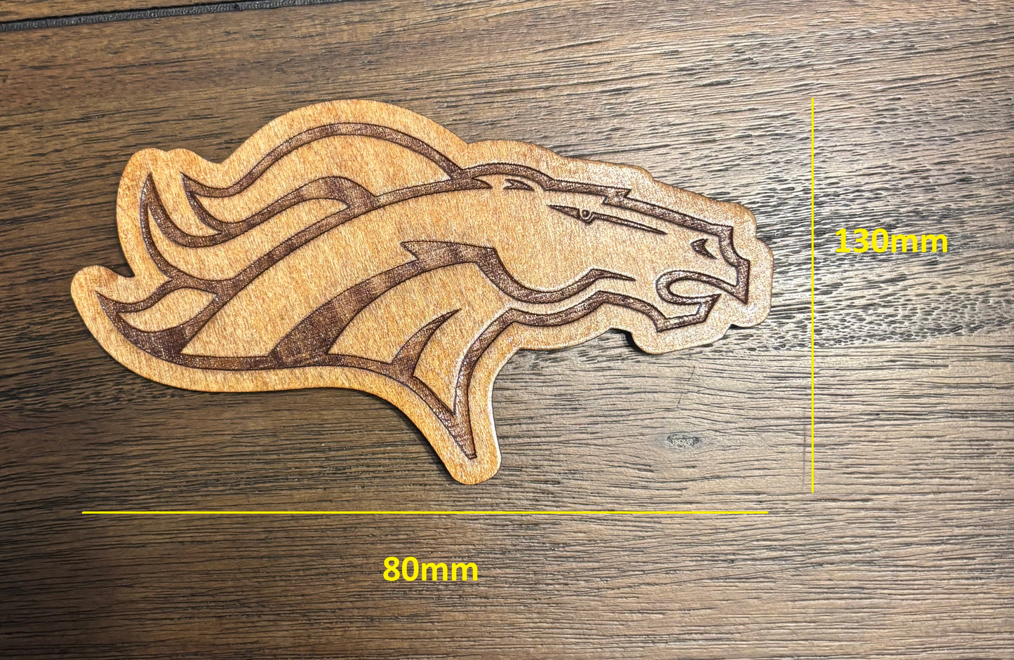 Stained basswood fridge magnet of the Denver Broncos football team logo