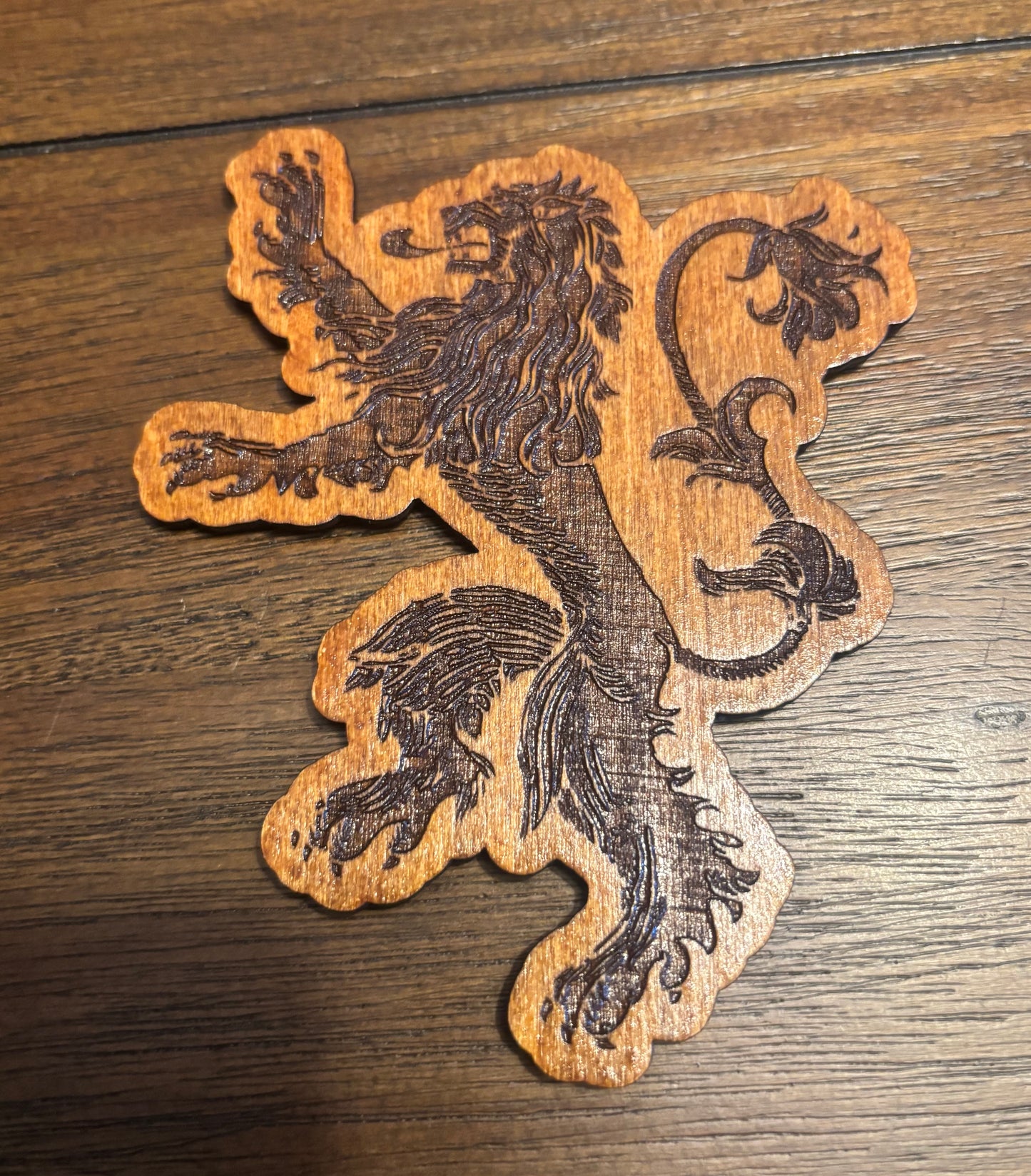 Stained basswood fridge magnet of the House Lannister sigil from Game of Thrones