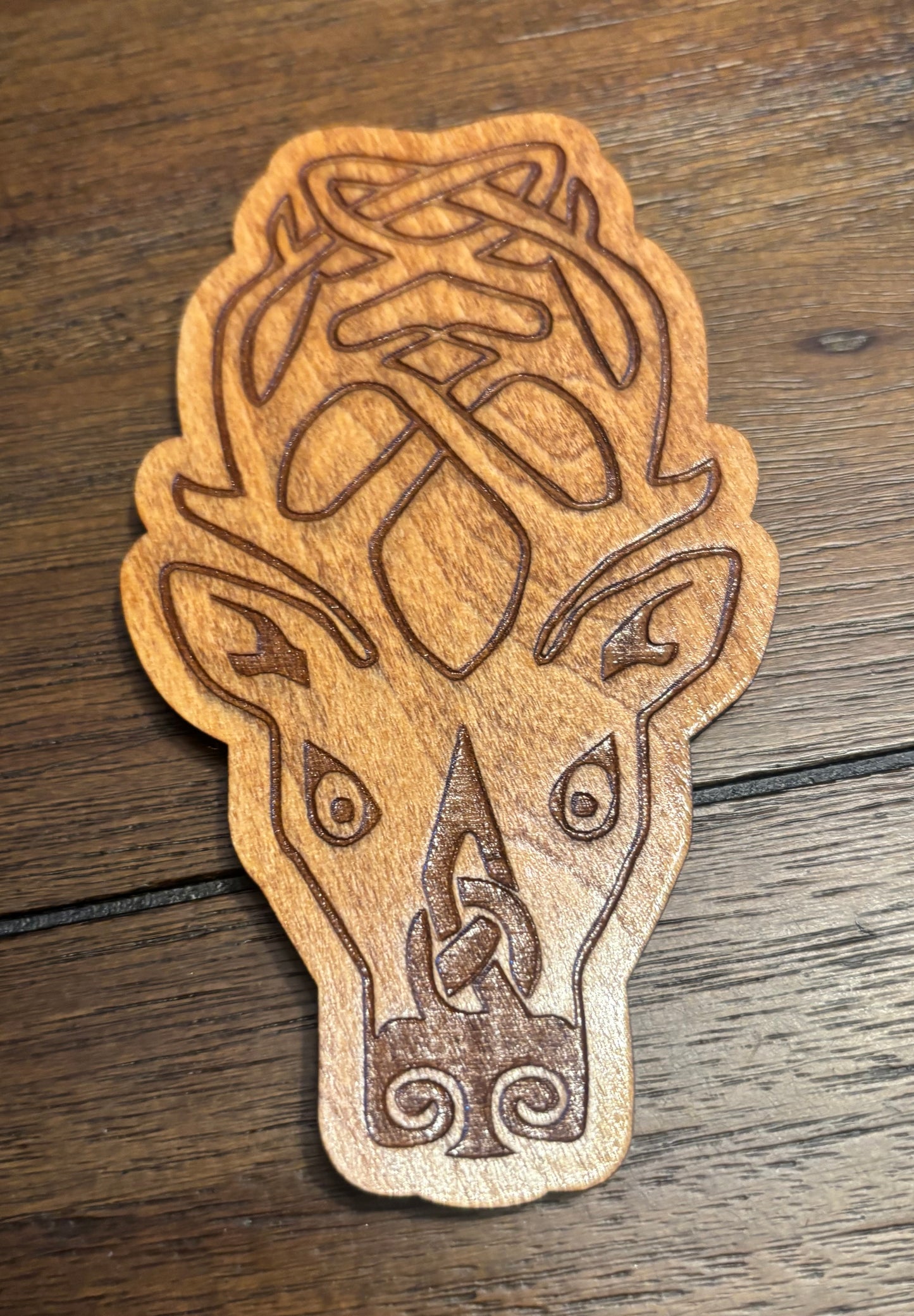 Stained basswood fridge magnet of the Falkreath sigil from the Skyrim video game