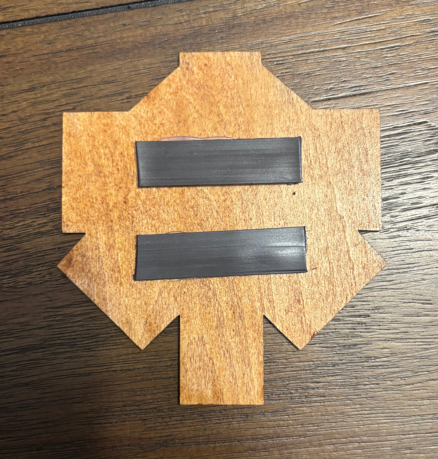 Stained basswood fridge magnet of the Advent logo from the X-COM video games