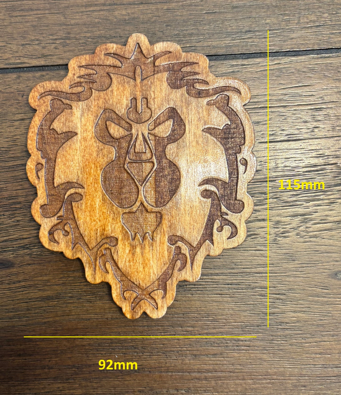 Stained basswood fridge magnet of a the Alliance symbol from the Warcraft video games