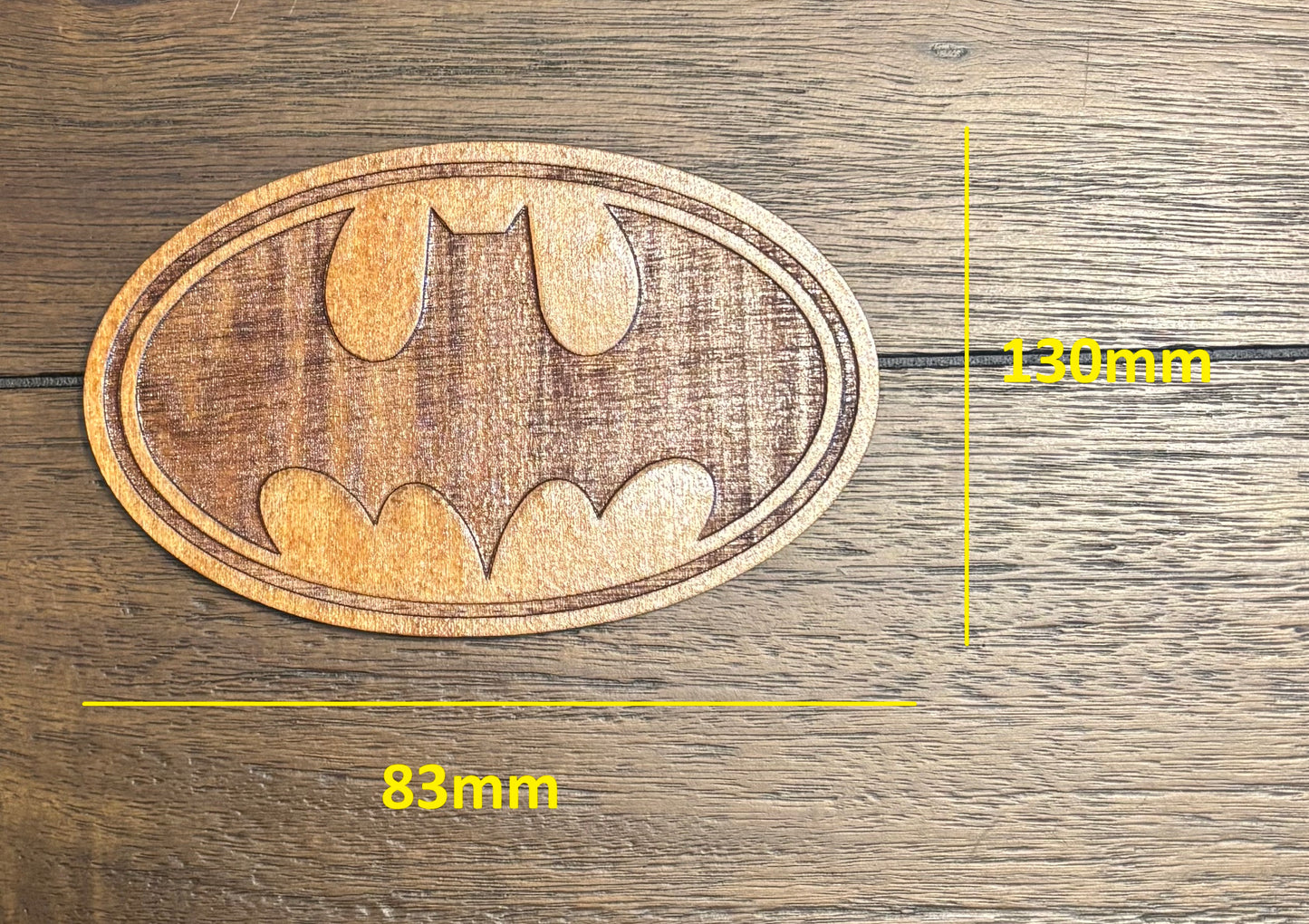 Stained basswood fridge magnet of the Batman logo
