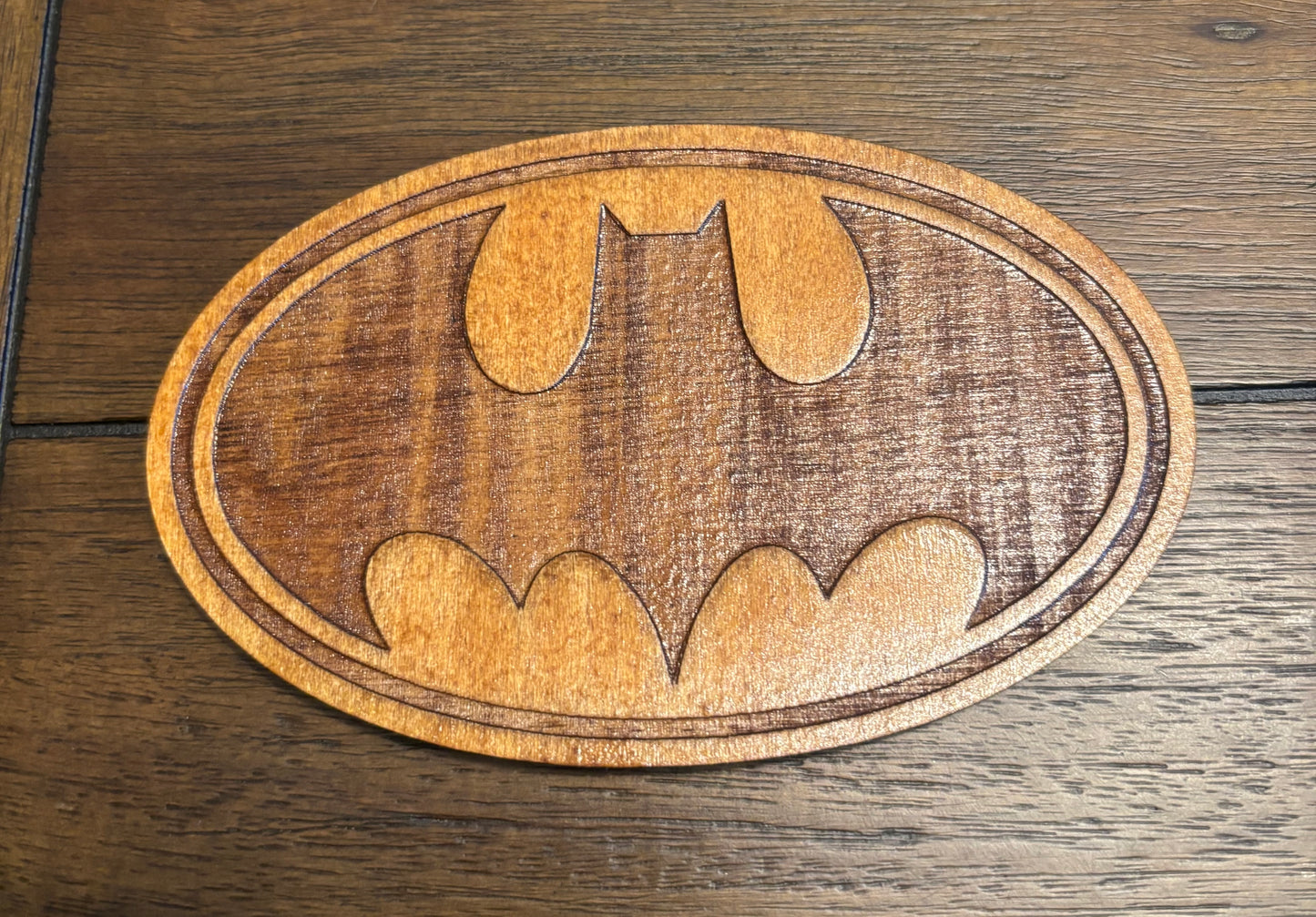 Stained basswood fridge magnet of the Batman logo