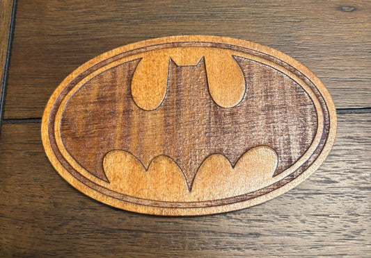 Stained basswood fridge magnet of the Batman logo