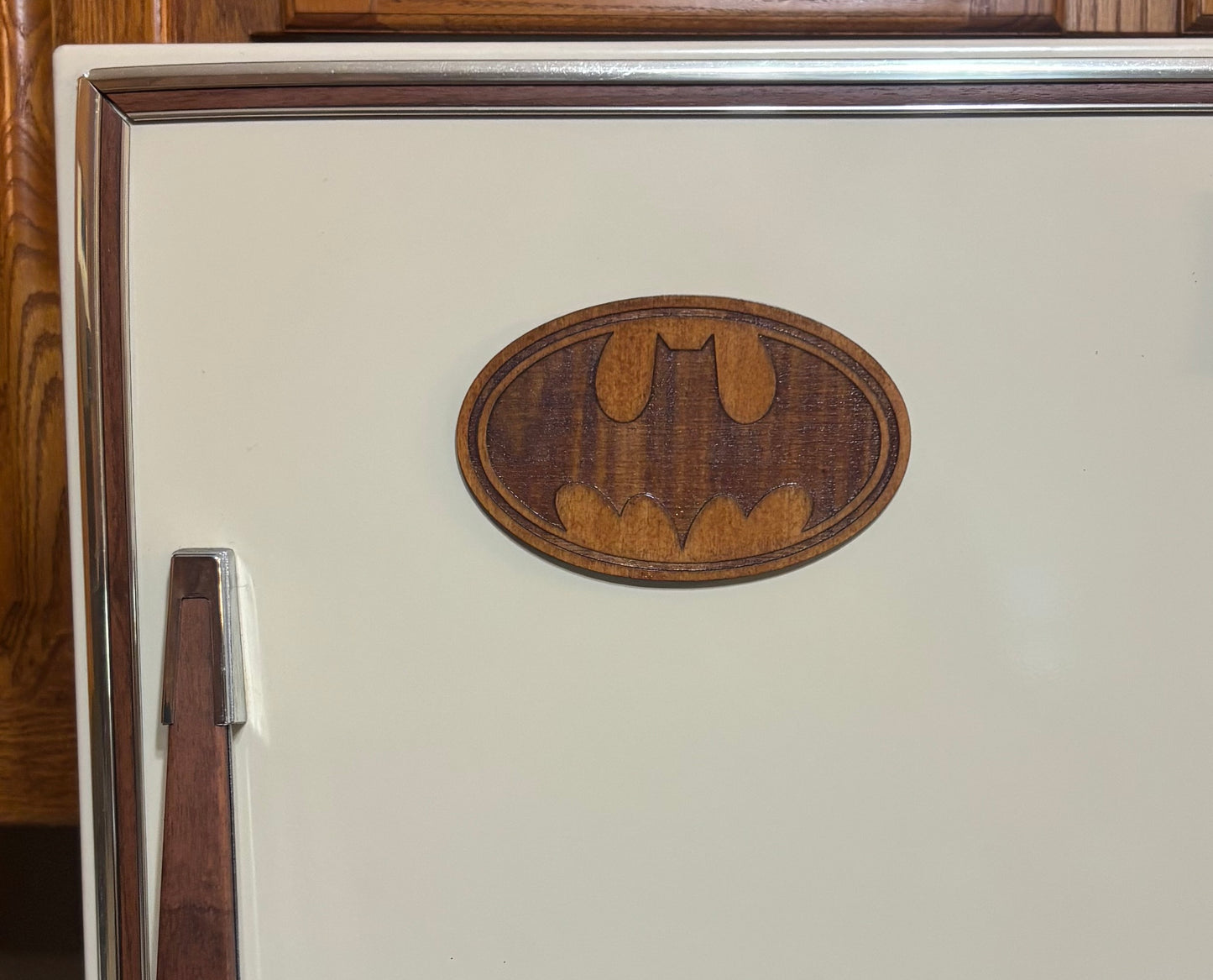 Stained basswood fridge magnet of the Batman logo