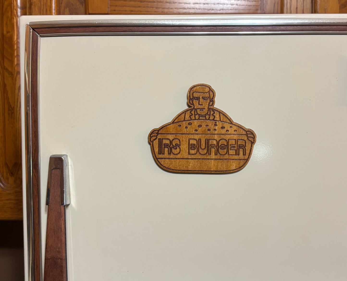 Stained basswood fridge magnet of IRS Burger logo from the Simpsons