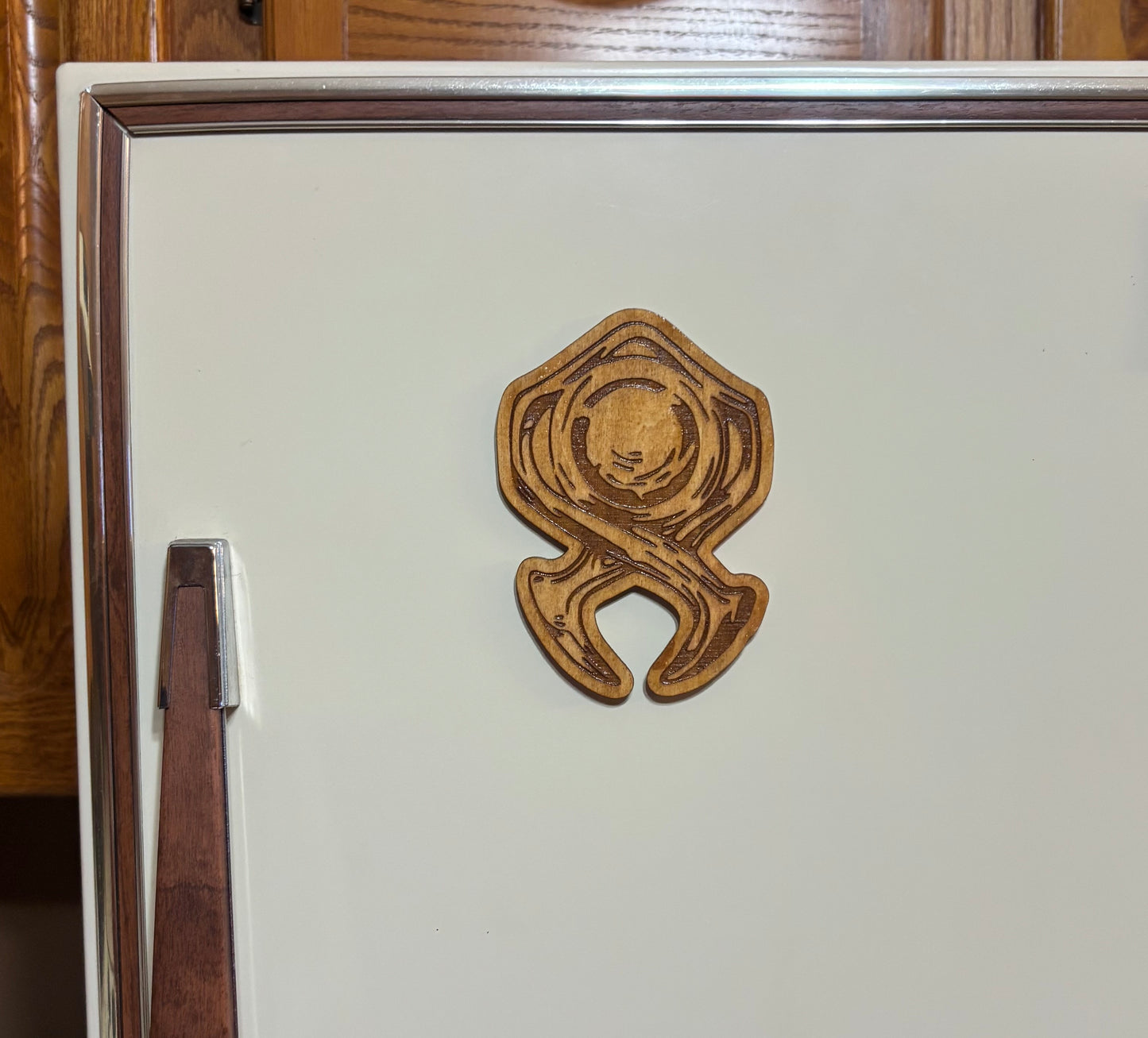 Stained basswood fridge magnet of the Horadrim symbol from the Diablo video games