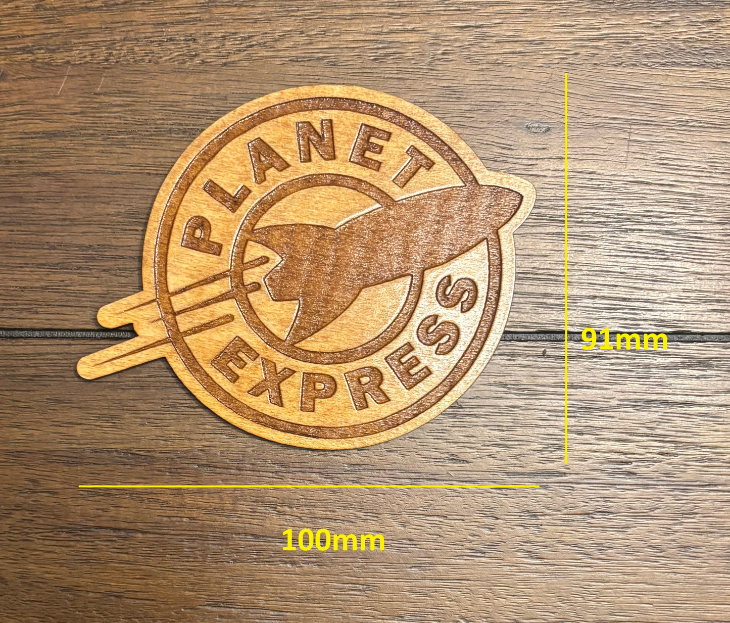 Stained basswood fridge magnet of the Planet Express logo from Futurama