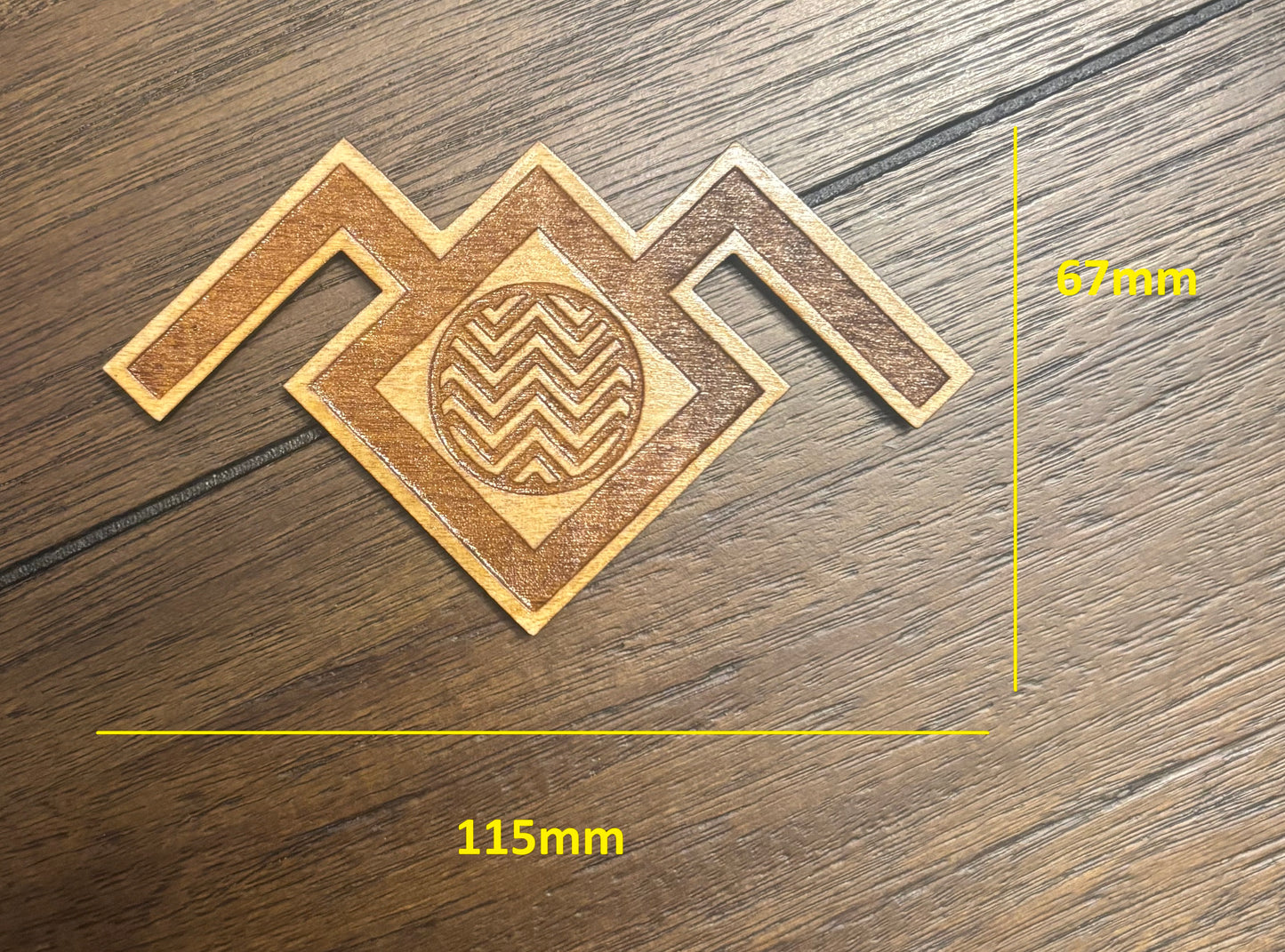 Stained basswood fridge magnet of the owl symbol from Twin Peaks