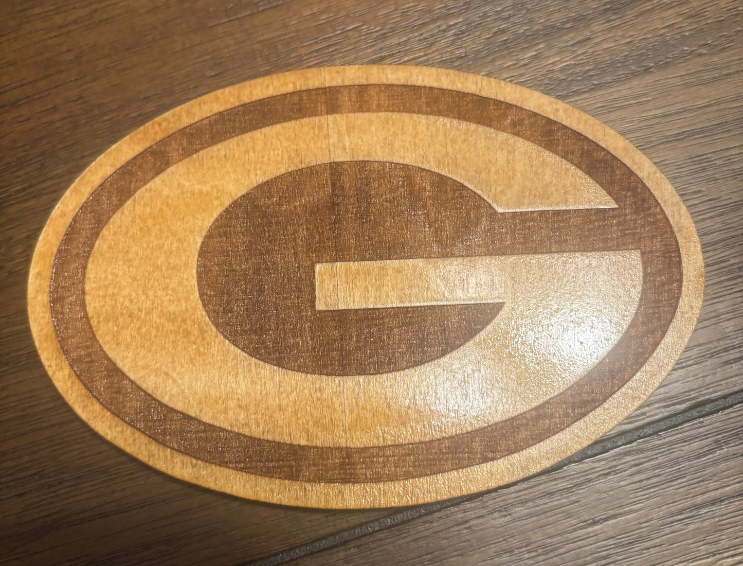 Stained basswood fridge magnet of the Green Bay Packers football team logo