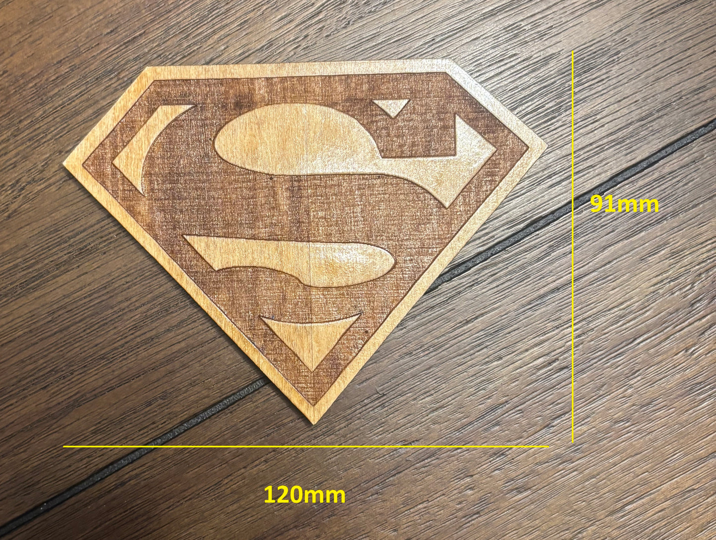 Stained basswood fridge magnet of the Superman logo
