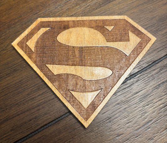 Stained basswood fridge magnet of the Superman logo
