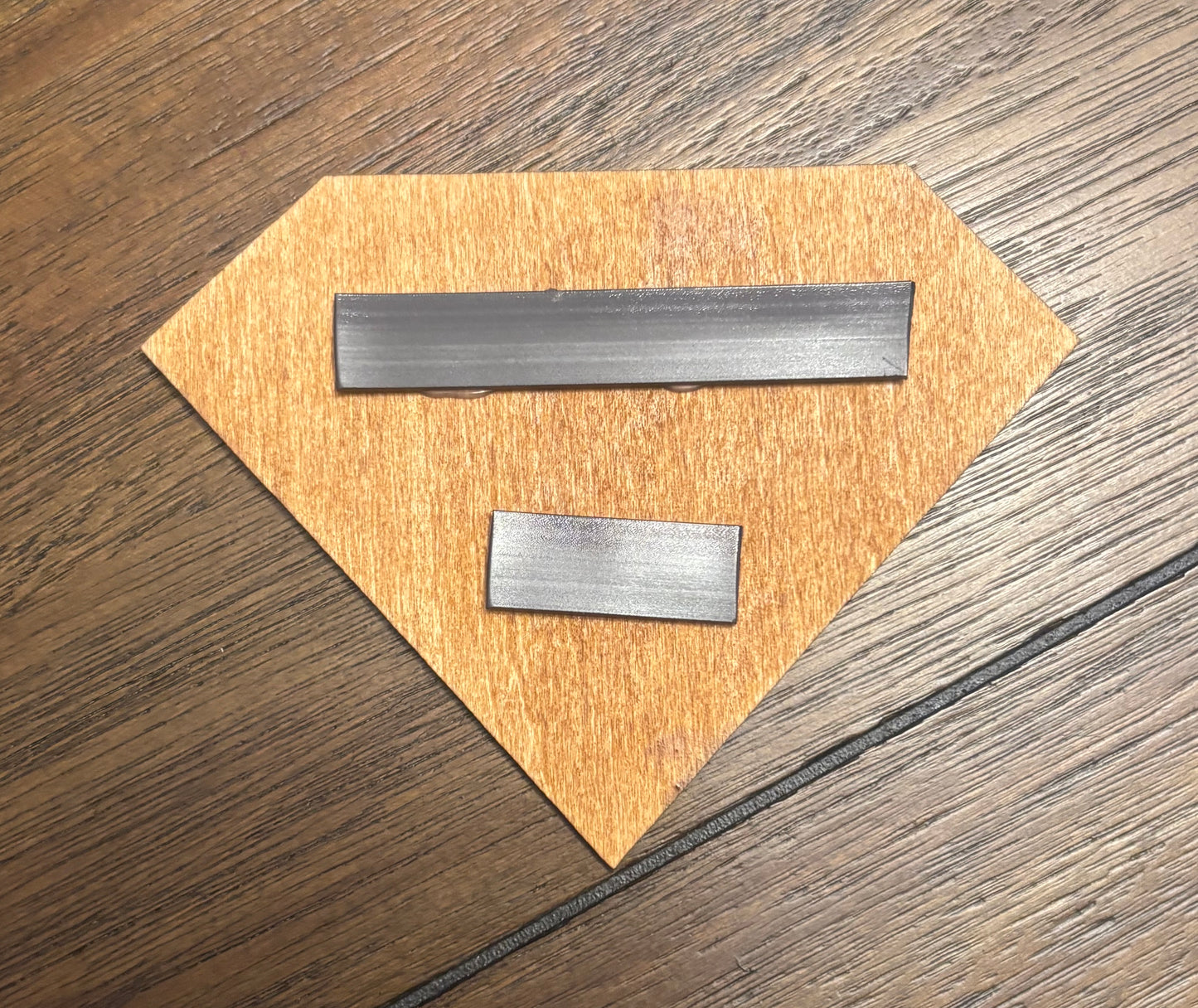 Stained basswood fridge magnet of the Superman logo