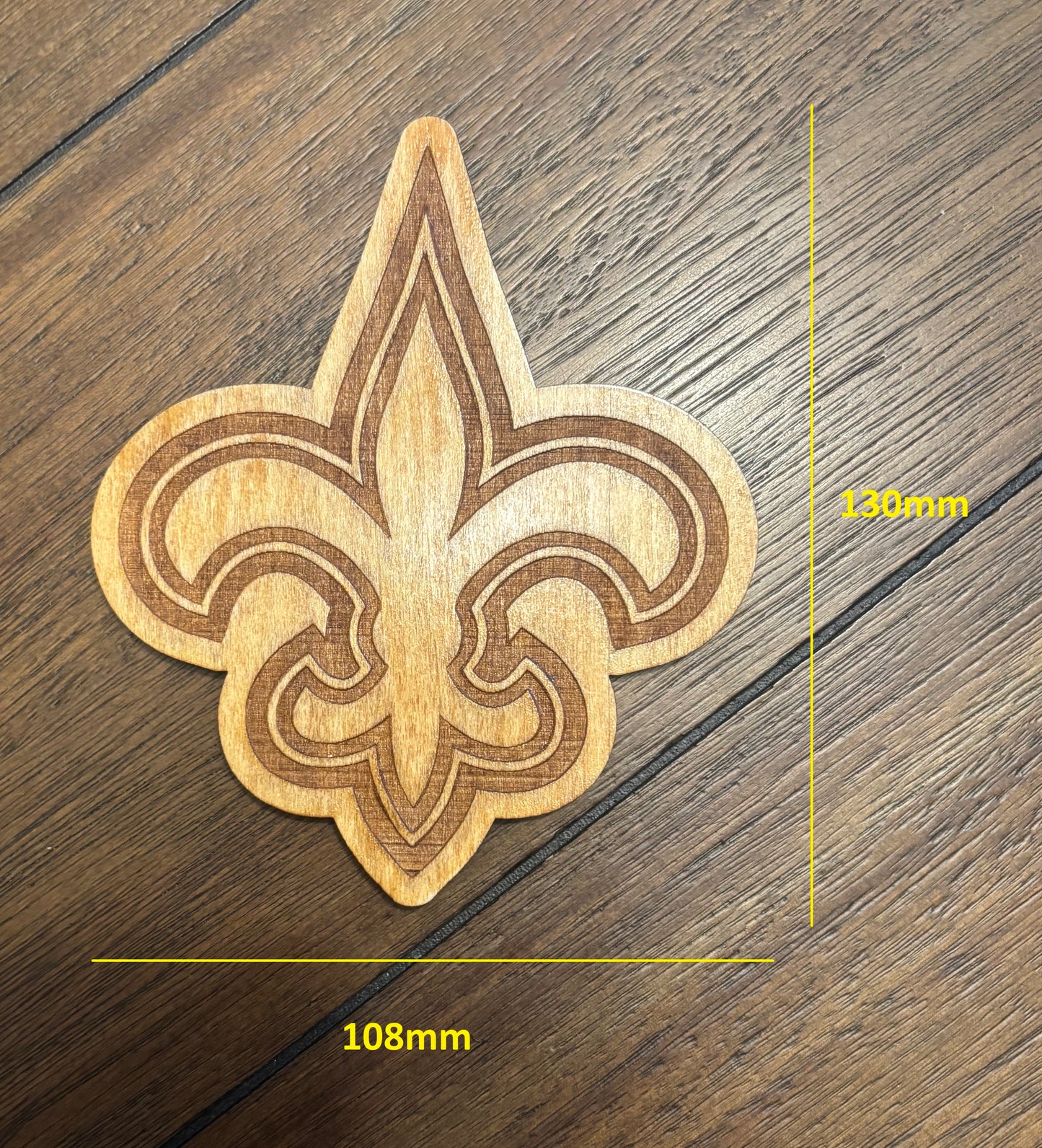 Stained basswood fridge magnet of the New Orleans Saints football team logo