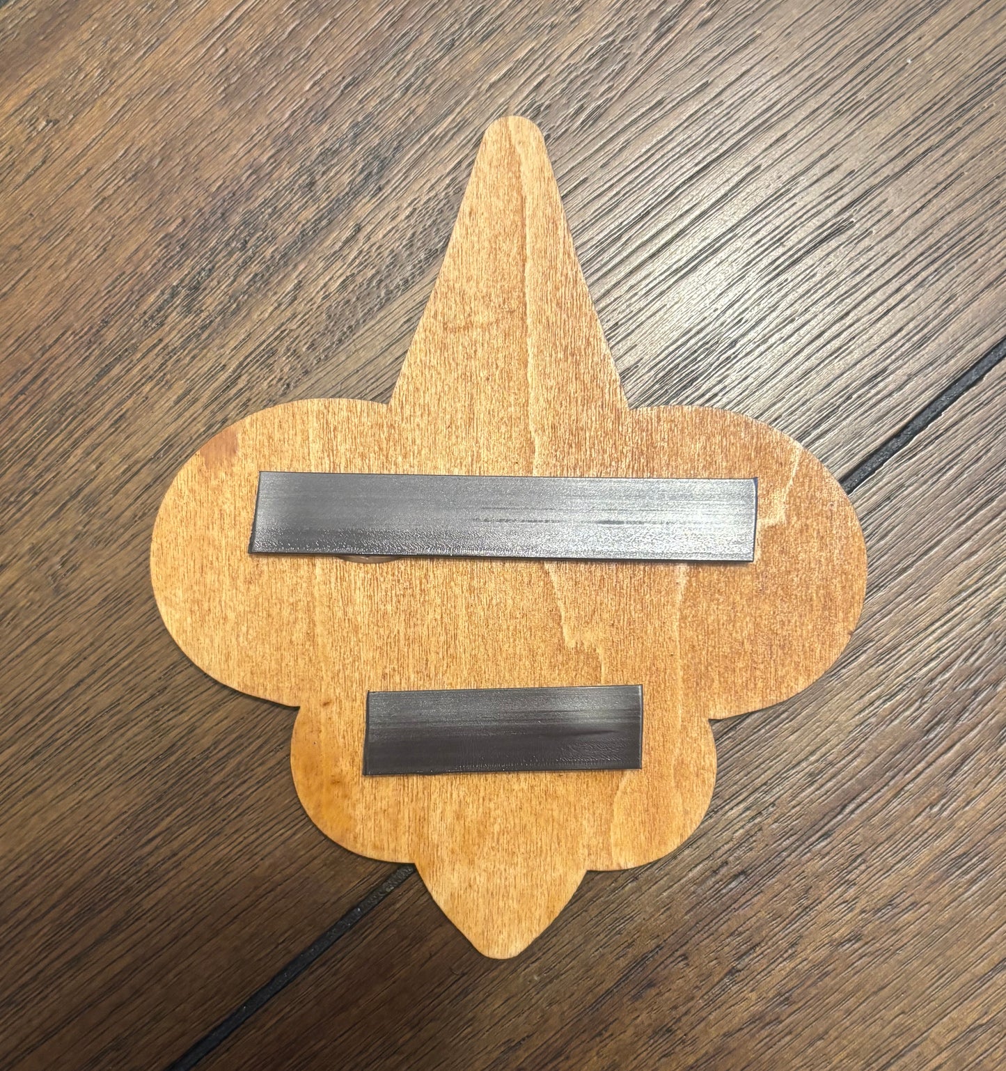 Stained basswood fridge magnet of the New Orleans Saints football team logo