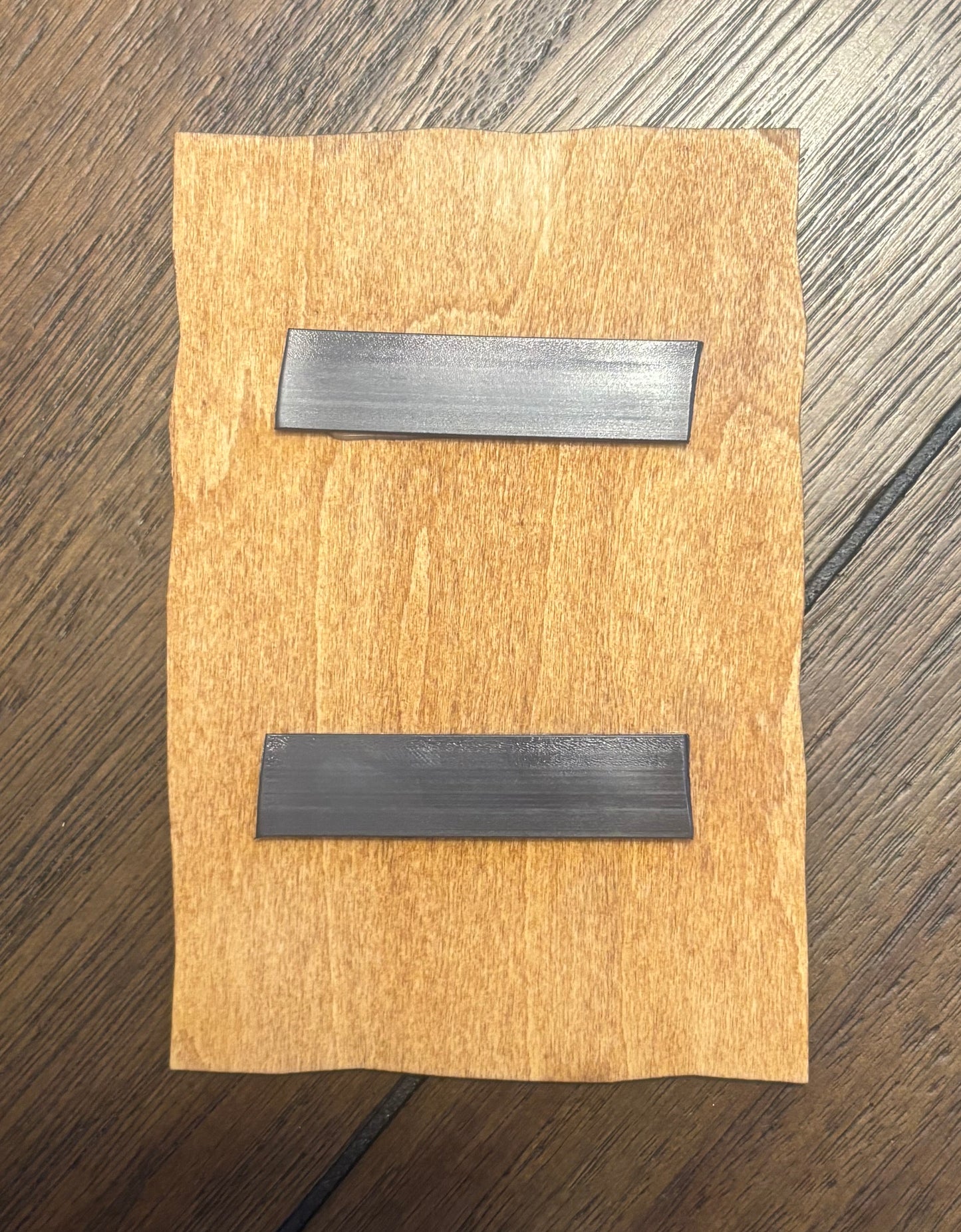 Stained basswood fridge magnet of Nelson's Nuke the Whales poster from the Simpsons