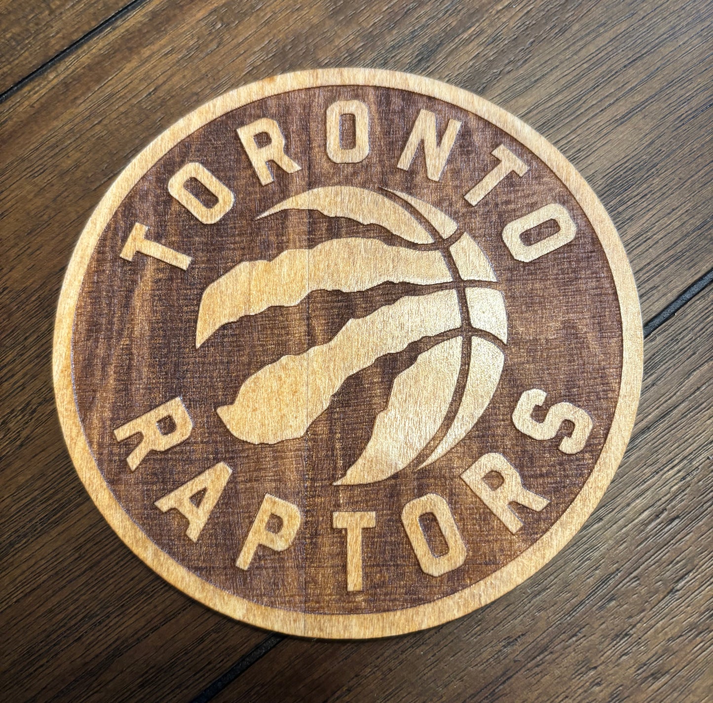 Stained basswood fridge magnet of the Toronto Raptors basketball team logo