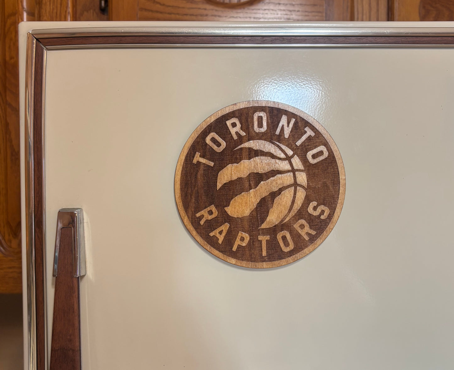 Stained basswood fridge magnet of the Toronto Raptors basketball team logo