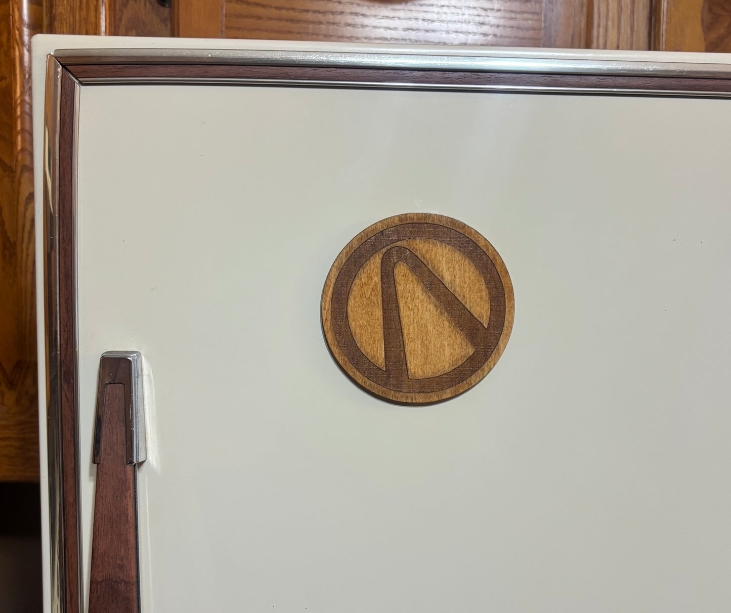 Stained basswood fridge magnet of the Vault logo from the Borderlands video games