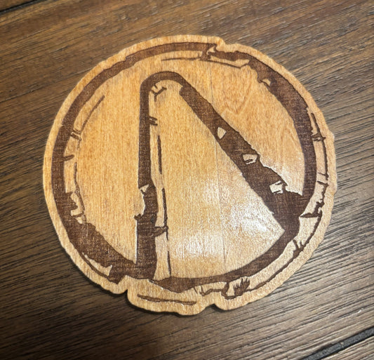 Stained basswood fridge magnet of the weathered Vault logo from the Borderlands video games