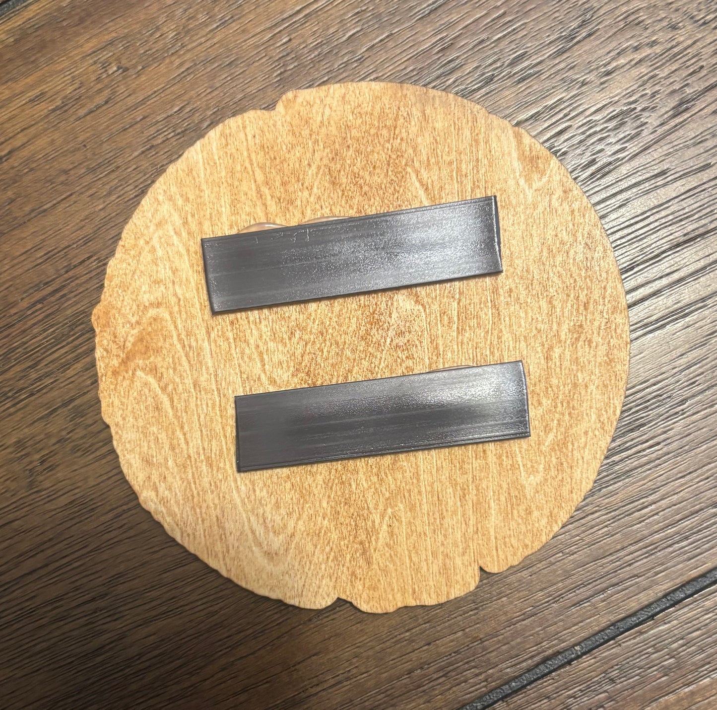 Stained basswood fridge magnet of the weathered Vault logo from the Borderlands video games