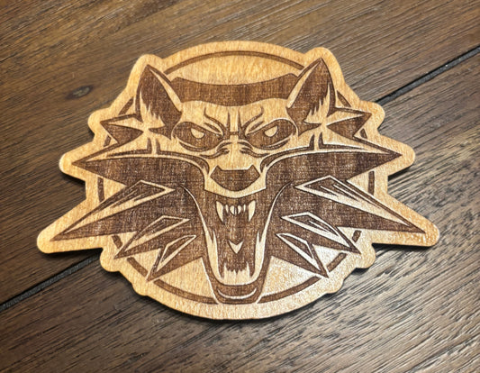 Stained basswood fridge magnet of the Witcher (alternative) logo
