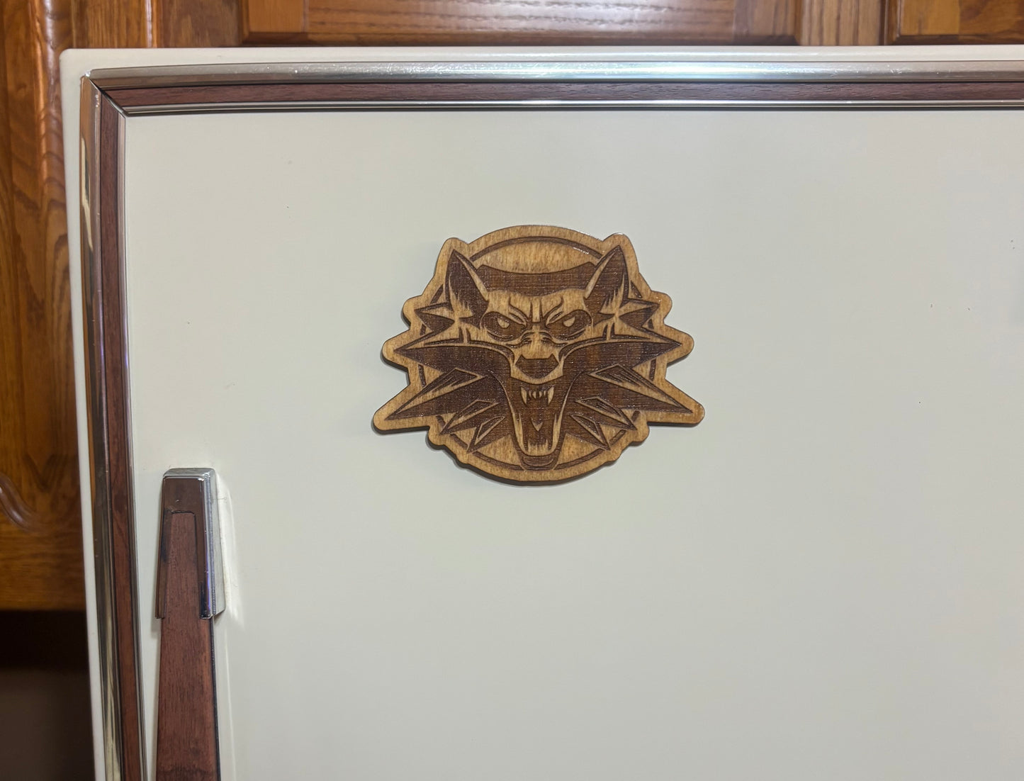 Stained basswood fridge magnet of the Witcher (alternative) logo