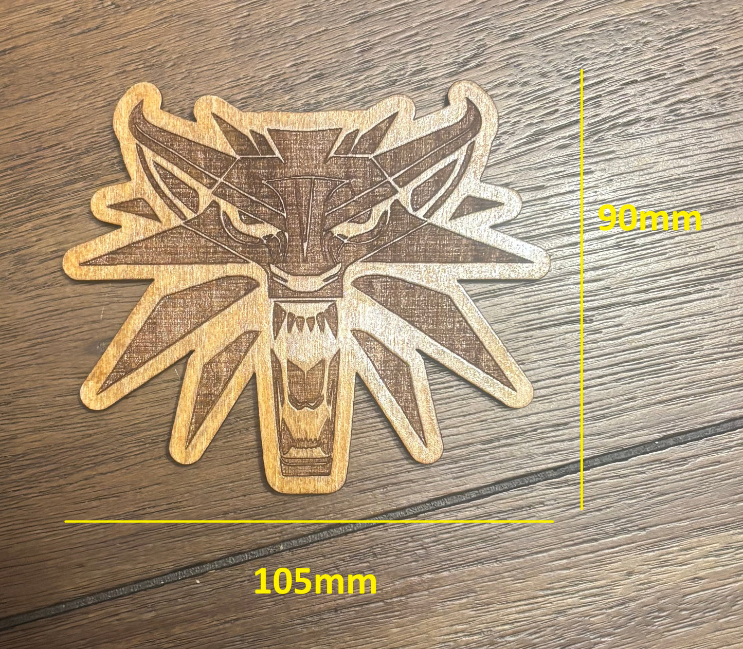 Stained basswood fridge magnet of the Witcher logo